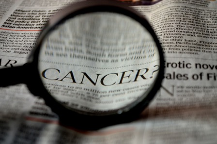 Newspaper asking the question, what is cancer?